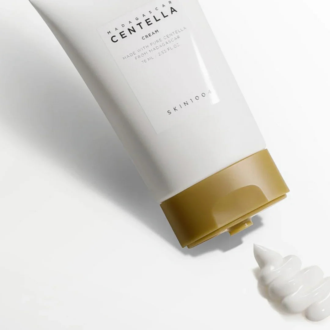 SKIN1004 Madagascar Centella Cream 75ml tube with gold cap on white surface and cream swirl
